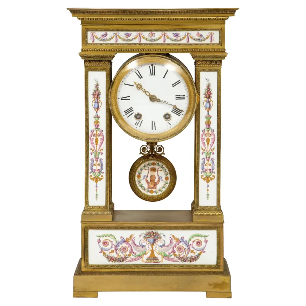 A Restauration Period Porcelain Inset Ormolu Mantel Clock, Attributed to Deniere